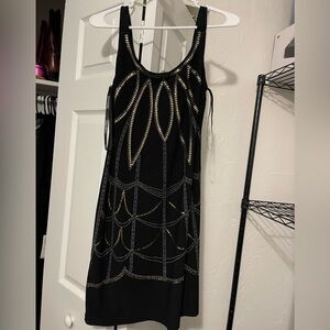 Bisou Bisou Black Dress with Gold Detailing